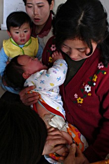 Child receives pentavalent vaccine in the DPR Korea