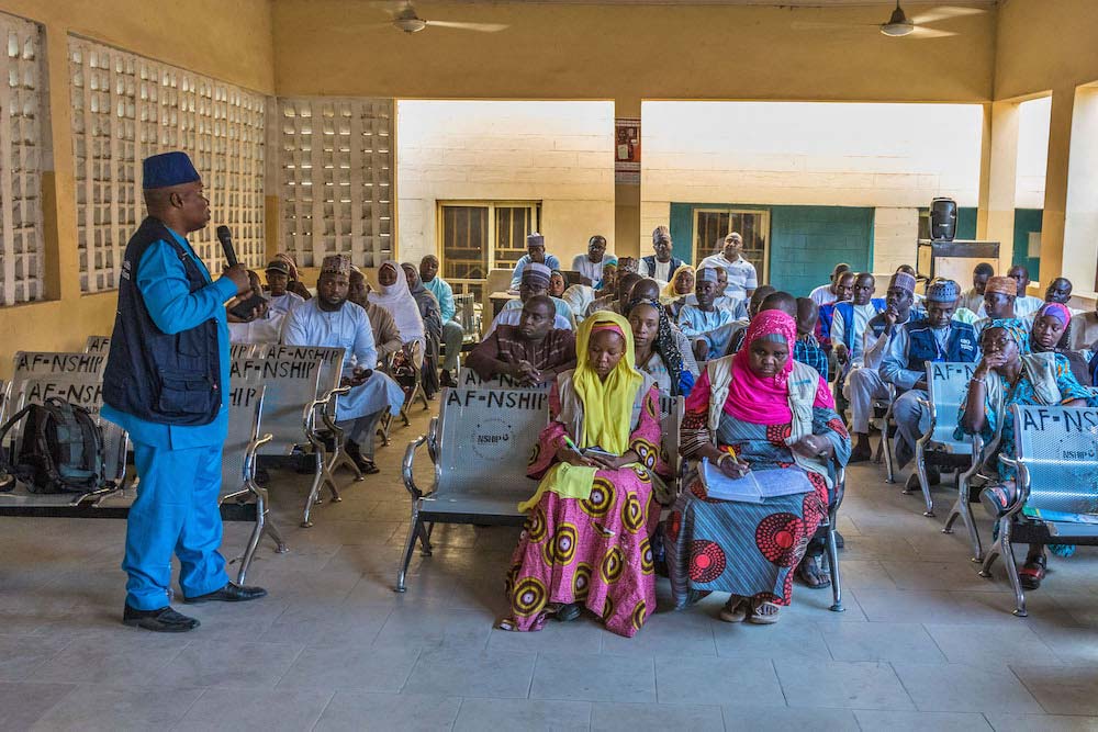 A local government council meeting with traditional leaders in Maiduguri, Borno State discusses the impact of recent immunization campaigns. © Andrew Esiebo/WHO