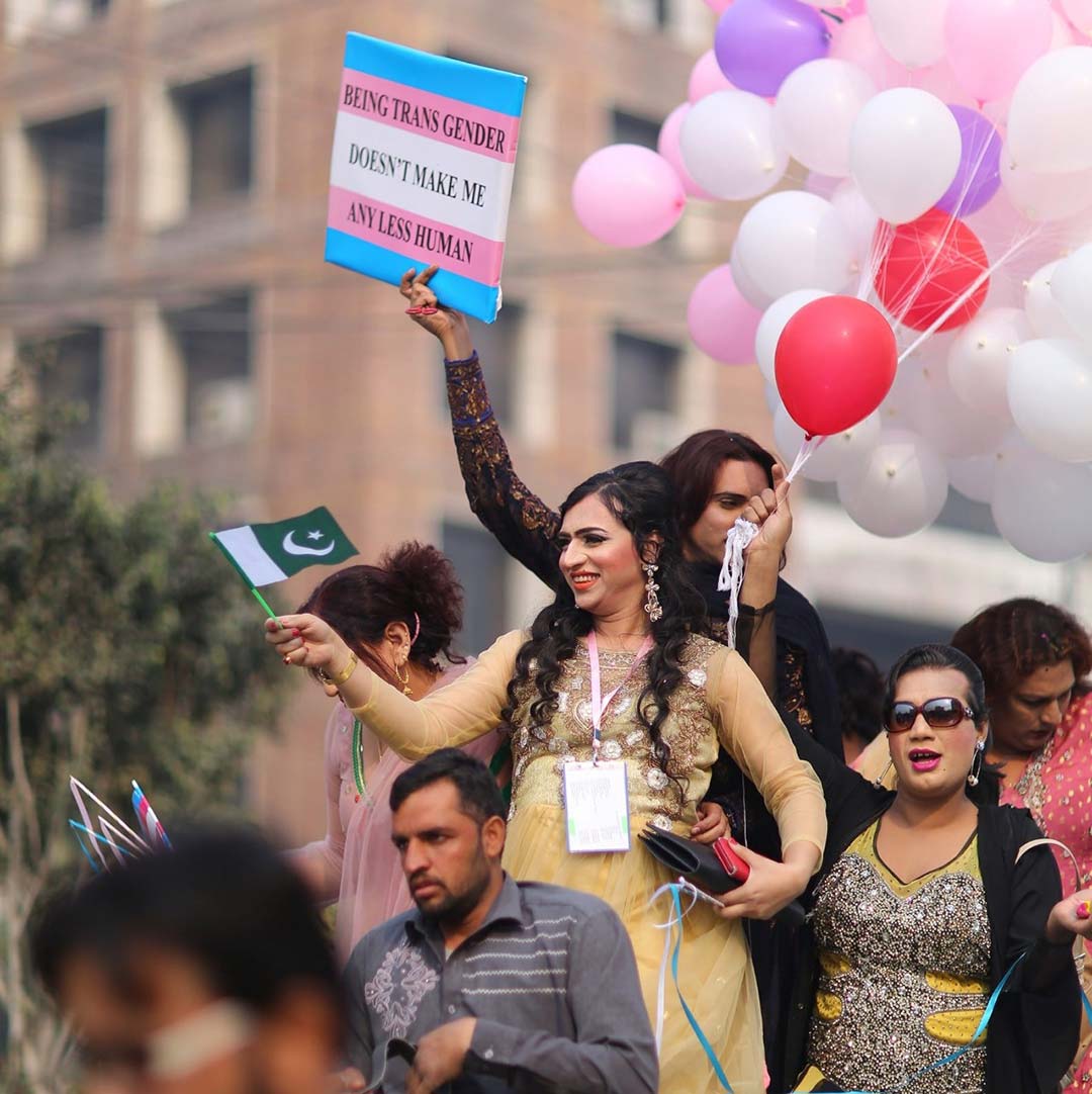 A group of transgender people with Pakistani flag demanding their due rights in a protest in Lahore. Credit: Saadeqa Khan