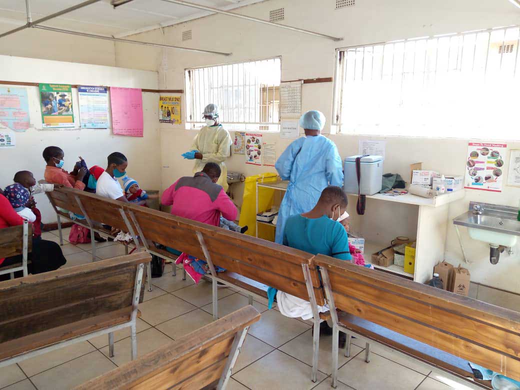 Nurses administering vaccines to children Credit: Elia Ntali