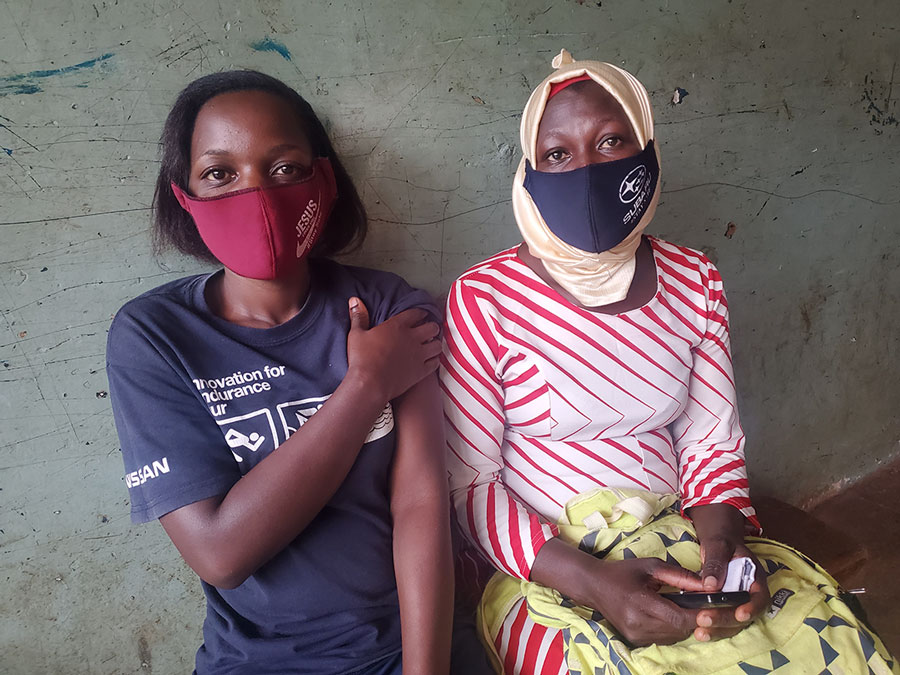Josephine Nakaayi (left), a teacher at City Primary School, and Rehema Faridah (right), a teacher at Rosa Kindergarten and Primary shortly after they both received their first vaccine doses.