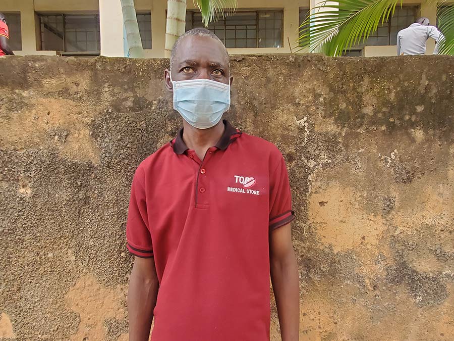 Niwagaba Rugymema, a support staff member at Bright Junior School shortly after being vaccinated. He is eager to return to his job once schools re-open. 