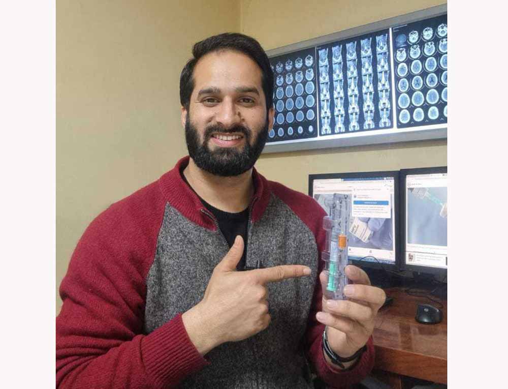 Anis Qureshi, a content creator from Jammu & Kashmir holds HPV vaccine while making informative video on Cervical Cancer.