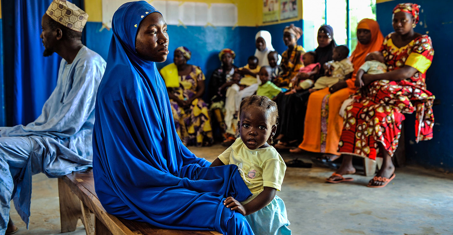 Mother and daughter waiting in a hospital in Nigeria