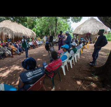 Dr. Sakoba Keita, coordinator of the Guinean Ebola Response speaks to local media during a village meeting on Ebola. The World Health Organisation ran phase III clinical trials for ebola virus disease vaccine in Guinea. Credit: Gavi/2015/Sean Hawkey.