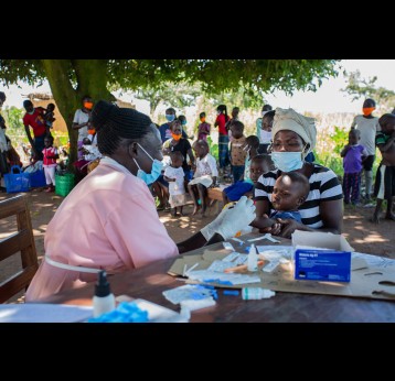 During a medical outreach in Amuru District, Uganda a health worker immunises a young child. Photo: Amref Health Africa