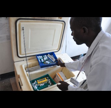 Vaccine product characteristics vary widely. Differences in volume, number of doses, and cold storage requirements—like the refrigerator shown here at Kimbiji Health Center in Tanzania – can have a big impact on cost. Photo: PATH/Doune Porter.