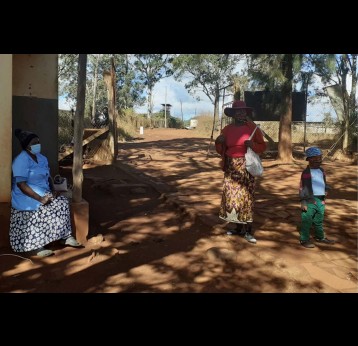 Betty Maseko interacting with a community member during the immunisation programme at Lomahasha clinic. Credit: Nonduduzo Kunene