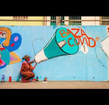 Oksanna Dias works on one of her pieces in central Luanda