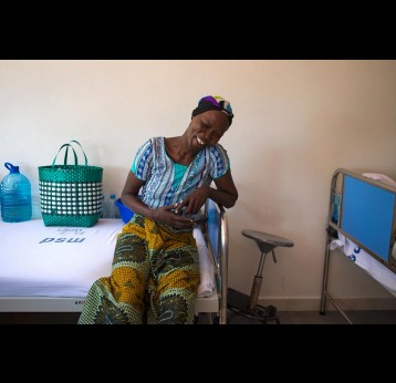 Cervical cancer patient Flora Jacobs poses with her head scarf to cover her hair loss at the Ocean Road Cancer Institute in Dar es Salaam. – Credit: Gavi/2014/Karel Prinsloo