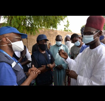 WR with a traditional leader in Borno State discussing community engagement for COVID-19 response