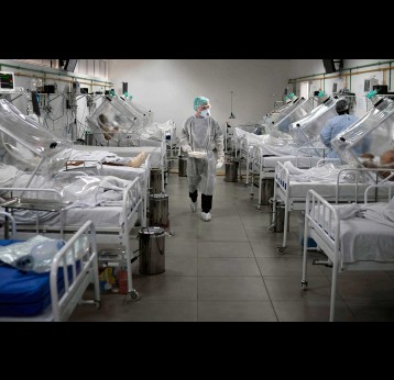 Medical staff work in the Intensive Care Unit (ICU) for COVID-19 multiple patients inside a special hospital.