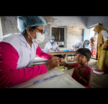 A young girl waiting for her zerodose vaccination in the Sunderbarn, India. Gavi/2022/Benedikt v.Loebell