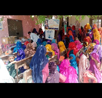 Flood affected women waiting for polio drops administration at Health Special Health camp of Rajanpur. Credit: ministry of National Health Services Regulations and Coordination