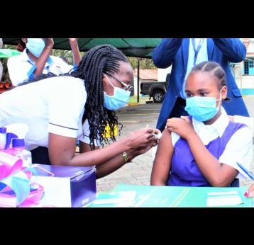 A school girl getting vaccinated against HPV