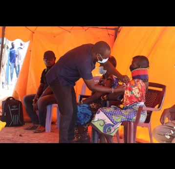 Meta Letipo receives her first AstraZeneca dose in Kalolol Village, Turkana County
