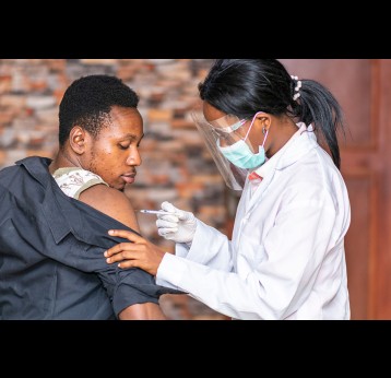 Medical personnel administers a vaccine to a patient