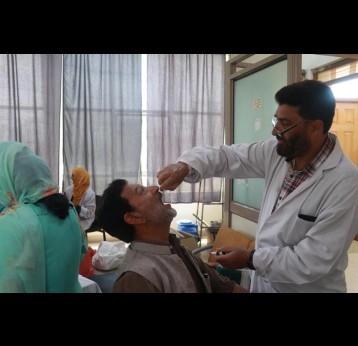 A paramedic administering mandatory polio drops to a Haj pilgrim at Haj House in Jammu &amp; Kashmir’s Srinagar. Credit: Nasir Yousufi