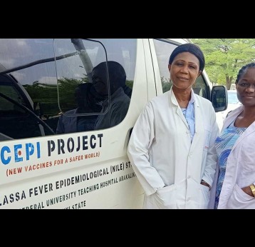 Dr Nnennaya Ajayi standing by hospital van. Credit: CEPI