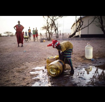 A child collects water from a borehole tap in Manyatta Secondary of Laisamis town in northern Kenya's Marsabit County. Credit: Kang-Chun Cheng