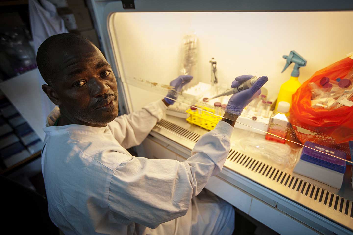 Health worker preparing Ebola vaccine for the Phase III trials in Guinea