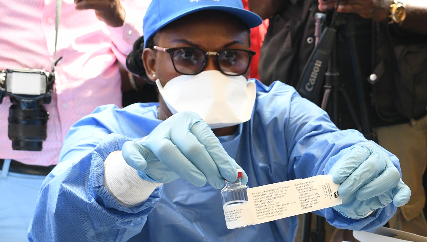 Protected health worker displays Ebola vaccine, DR Congo – Gavi/2018/Pascal Barollier