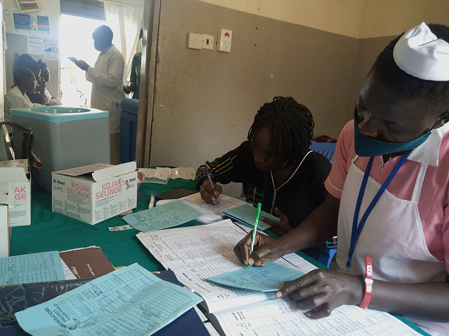 Health workers taking records of ongoing vaccinations at Munuki Health Center