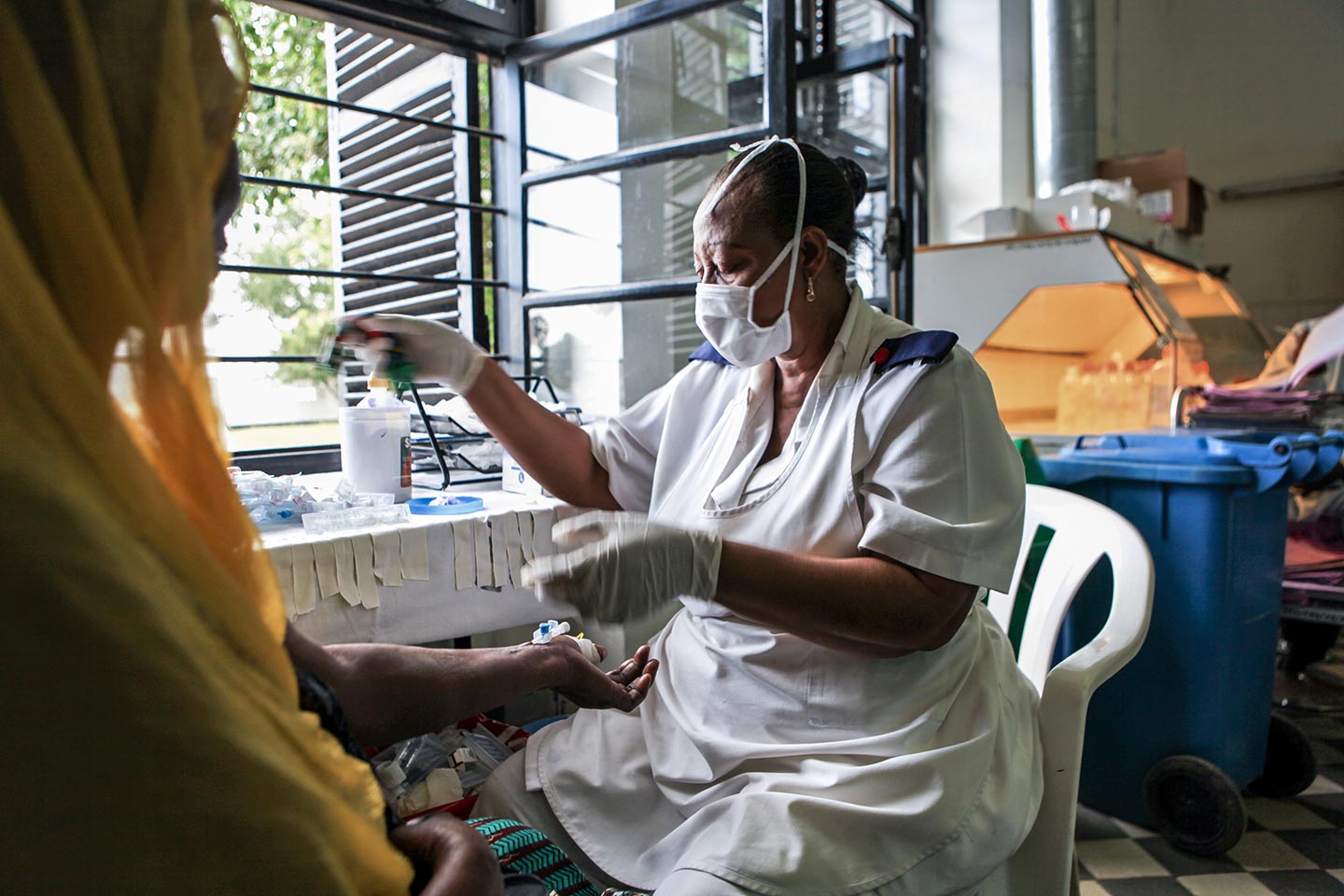 Nurse administering injection. – Credit: Gavi/2012/Sala Lewis