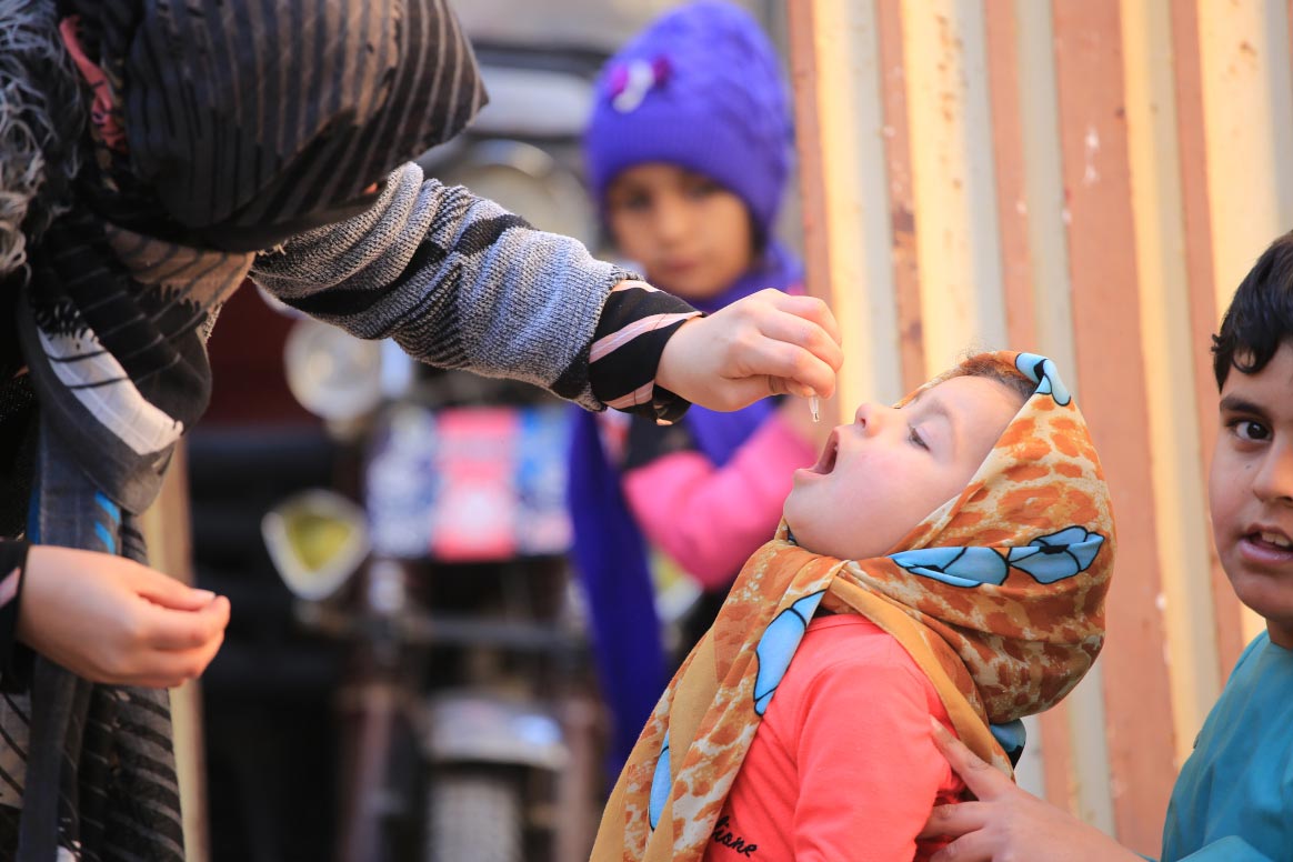 Aynaz, three years old is vaccinated in Herat City, Herat Province. ©Ramin Afshar/WHO Afghanistan