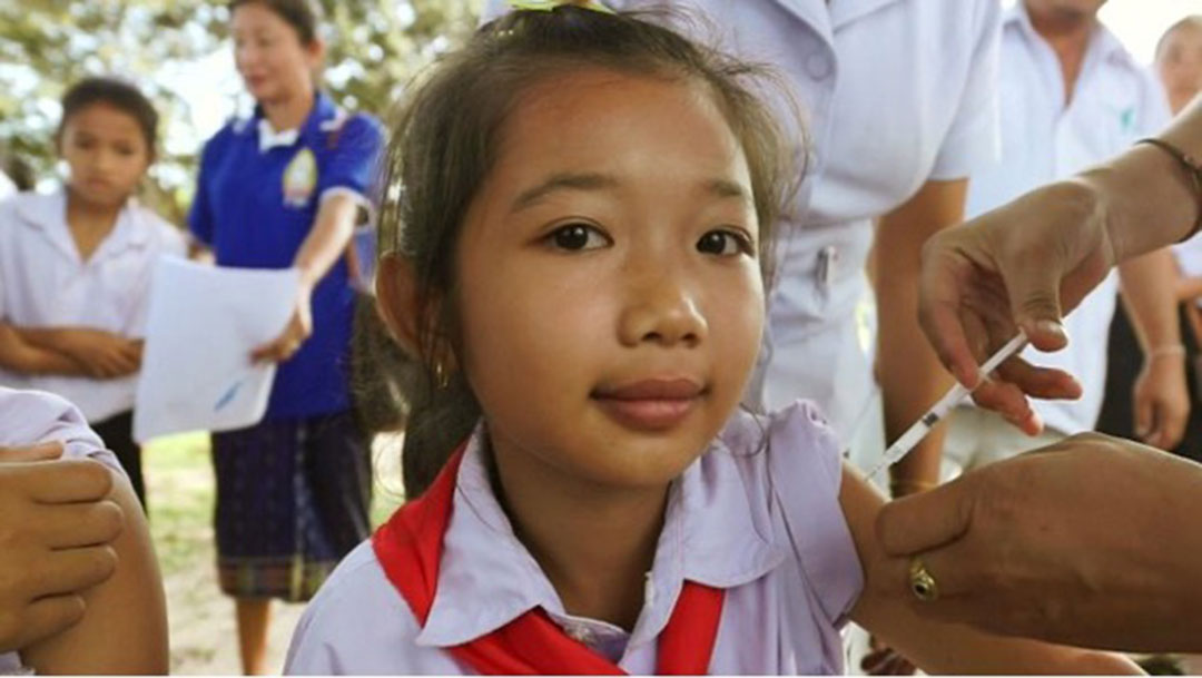 In Northern Laos, a girl gets her dose of HPV vaccine