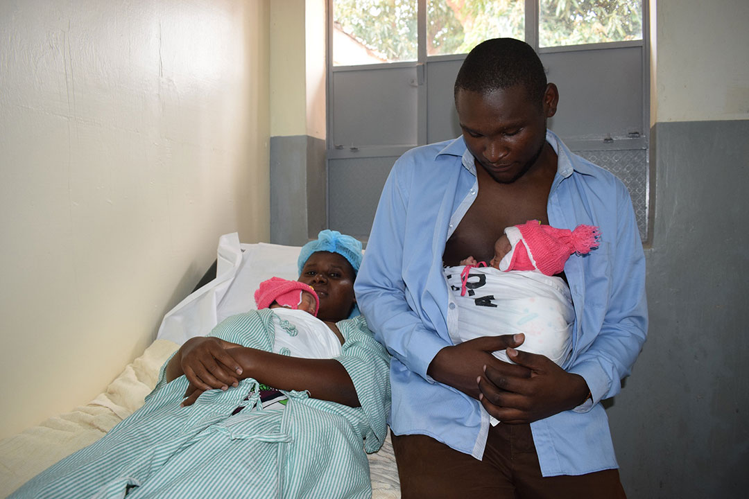 Kangaroo mother and father offering their infants skin-to-skin care in Kitui Kangaroo Mothers Care facility in Kitui, Kenya