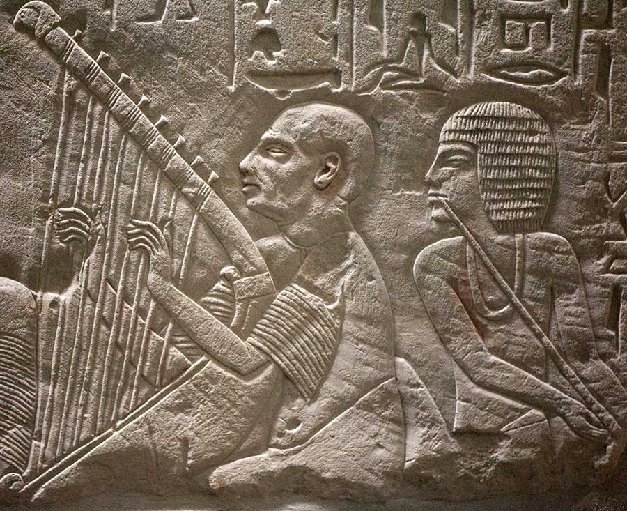 A blind harper, part of a relief from the tomb of Pa-aton-em-heb, found at Saqqara, now at the Leiden Museum. Source: Tomb chapel of paätenemheb (RMO Leiden egypt saqqara 1333-1307bc)