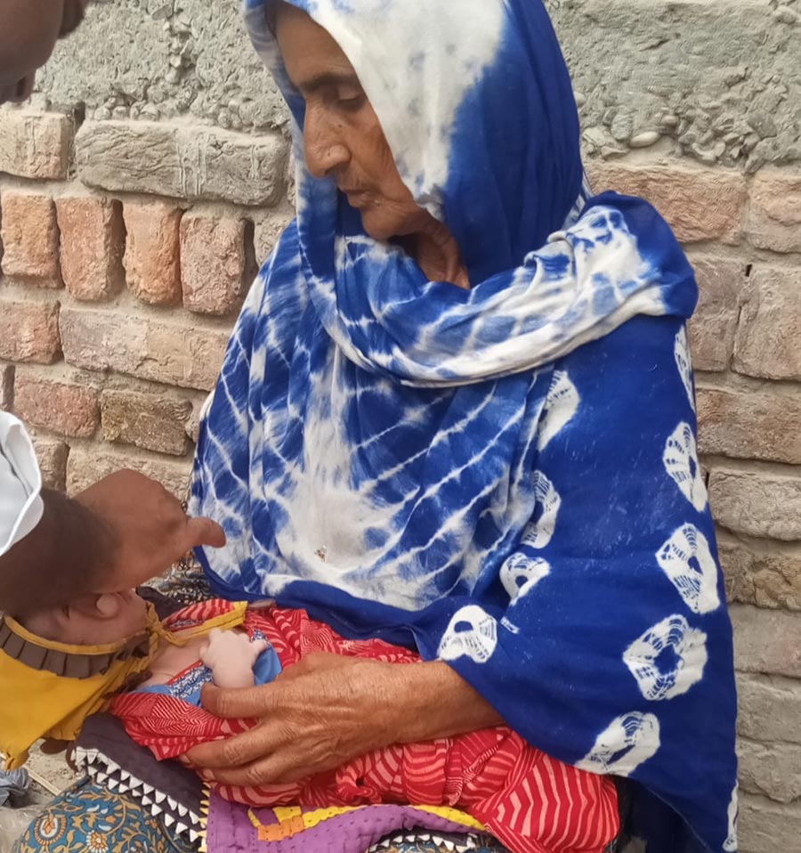 An infant gets his first polio dose in a remote town in Sindh province. Photo credit: Saadeqa Khan