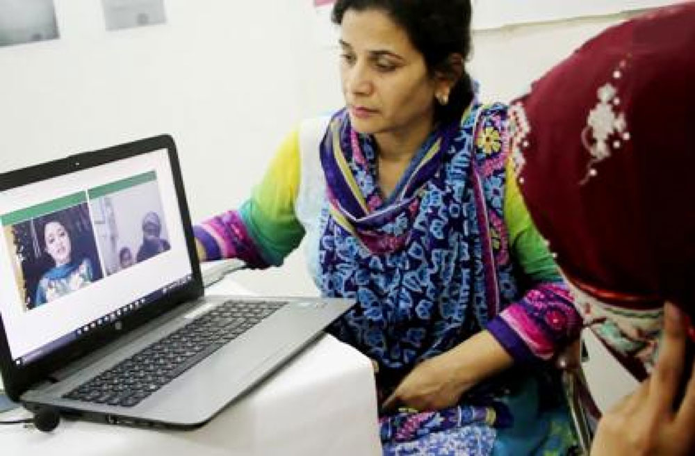 AFemale doctors are able to consult from their homes via web calls. Credit: Sehat Kahani
