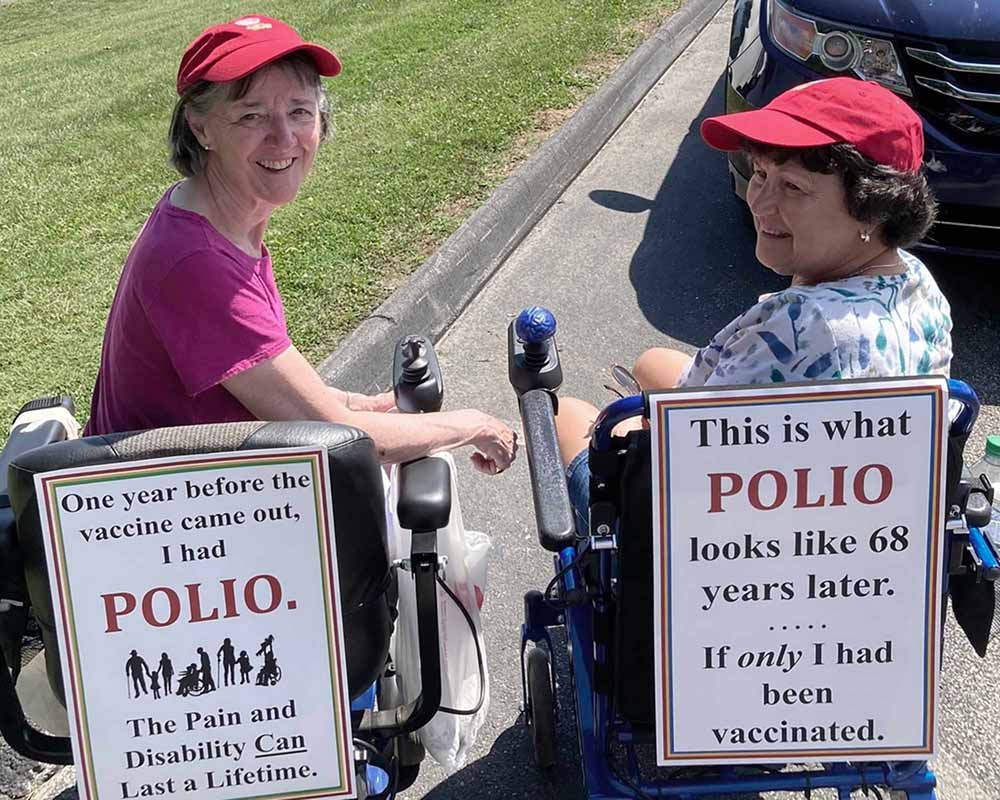 Until she was an adult, Carol Ferguson didn't know that she had been infected with polio as a child. Since she was diagnosed with post-polio syndrome, Ferguson helped establish a support group for those with PPS, and here she is pictured advocating for vaccination in an undervaccinated community in 2022. Credit: Carol Ferguson.