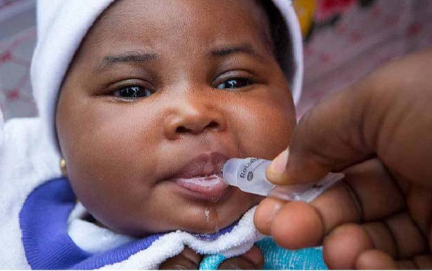 An infant gets her dose of oral rotavirus vaccine in Bondeni. Credit: Julie Mwabe, CDC Kenya.