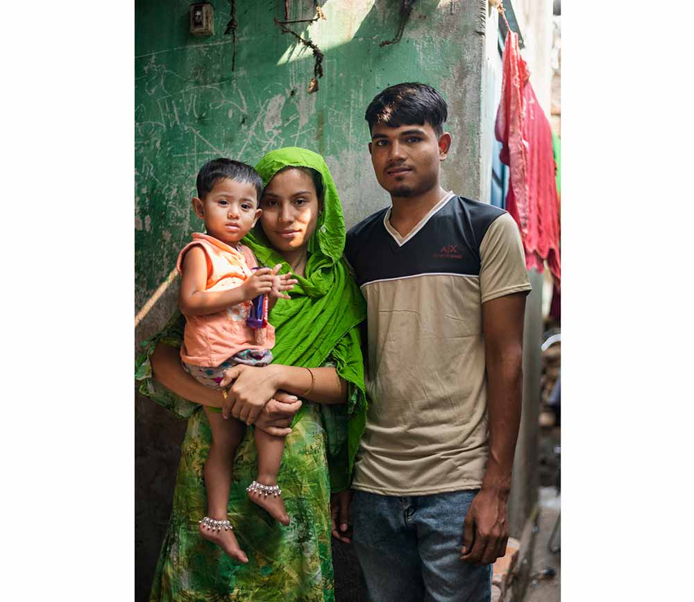 Shekh, 25, with his wife and their 2-year-old daughter  Dhaka, Bangladesh  Photographer: Ashraful Arefin