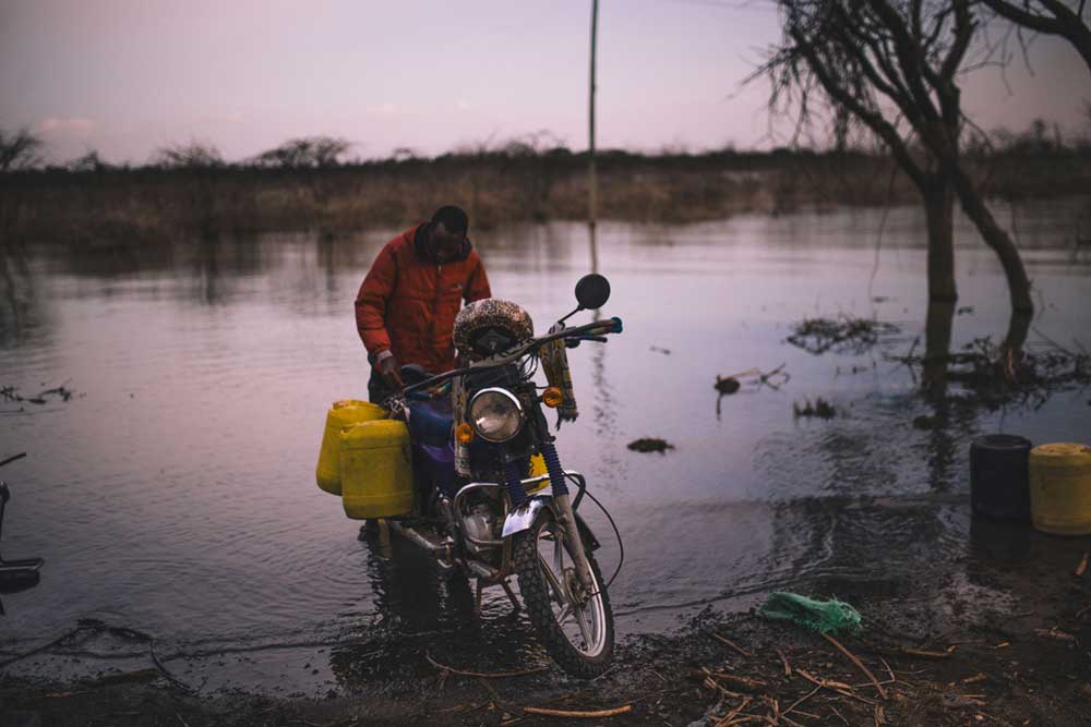 A young man collecting water for household use from Lake Baringo in Kenya's former Rift Valley Province.