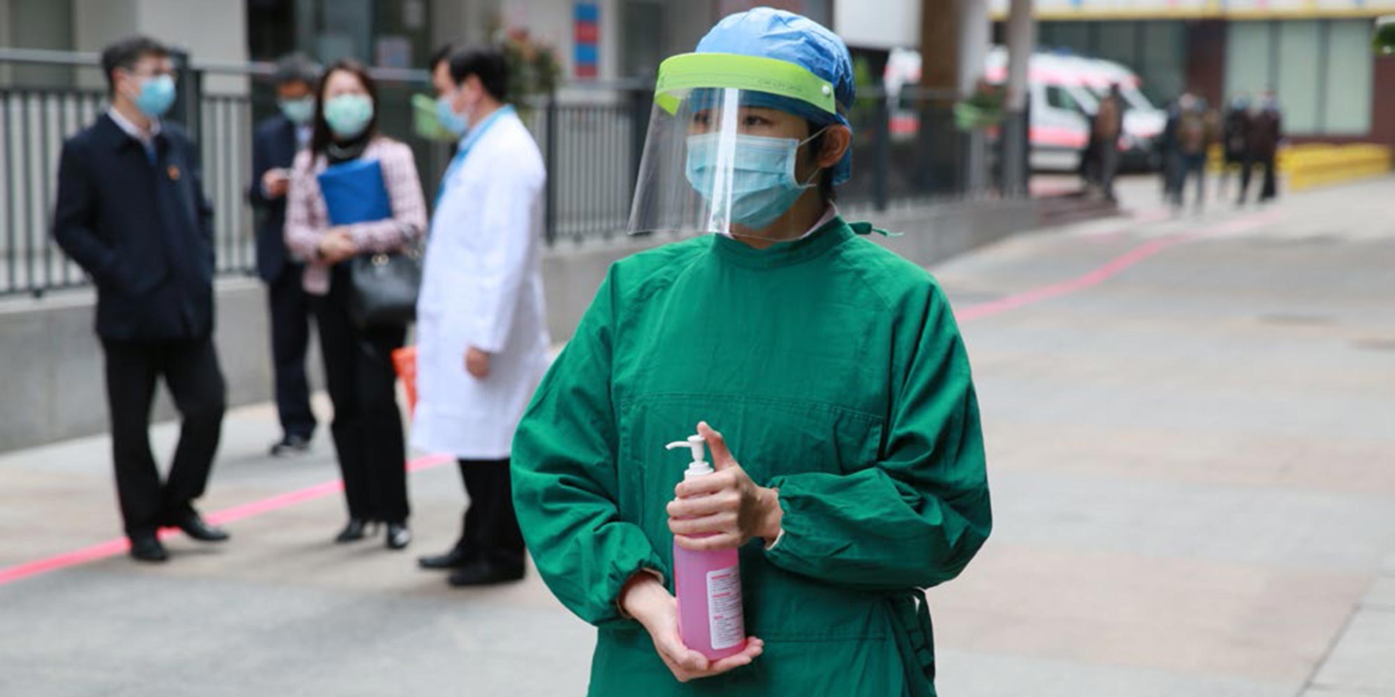 A woman dispenses hand sanitizer at the Guangzhou Women and Children's Health Medical Center in Guangzhou, Guangdong Province. WHO/2020