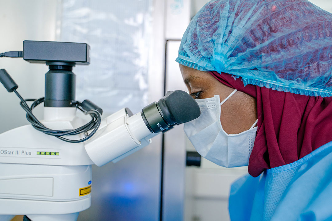 Dr Sène Marie-Angélique, Head of the Microbiology and Analytical Development Lab, looks through a microscope, at the Institut Pasteur in Dakar, Senegal, on June 16, 2022. Credit: Pasteur Institute Senegal