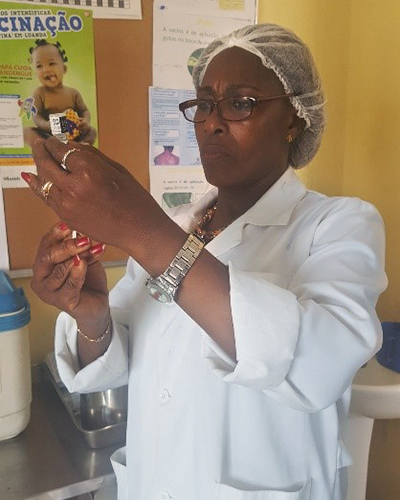Female health worker preparing a vaccine