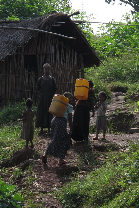 Women and children carry water in Beshangul-Gumuz region. One of the world’s poorest countries, Ethiopia ranks 157th out of 169 on the UN’s 2010 human development index.
