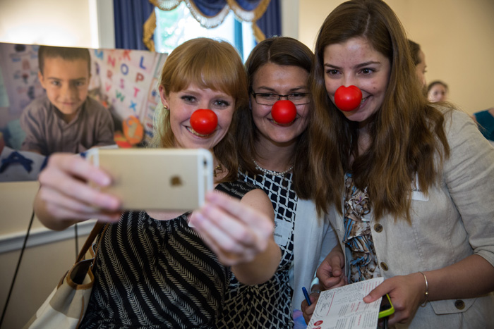 Guests enjoy the Red Nose Day photo booth