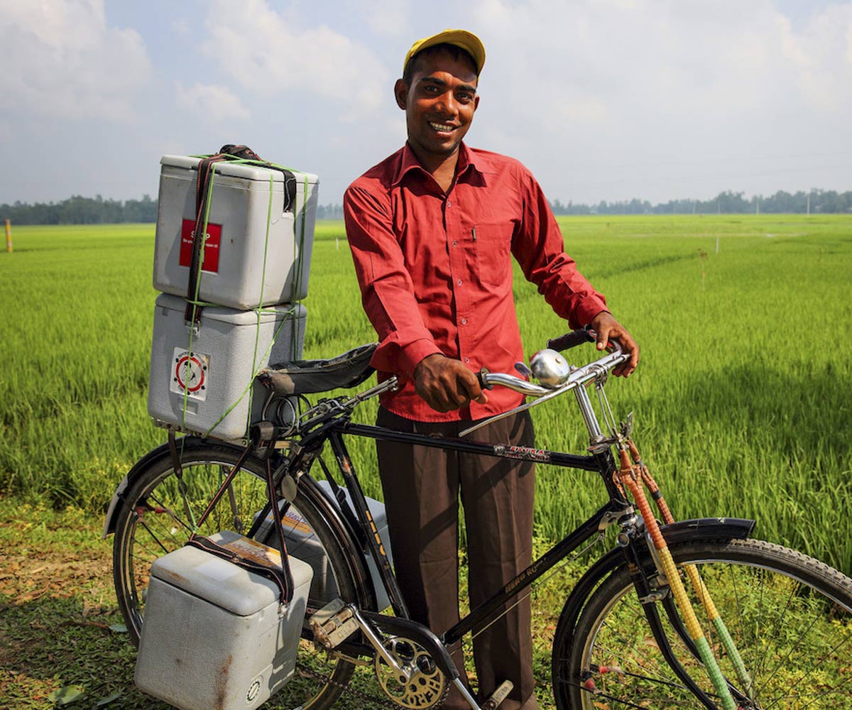 Transporting vaccines by bicycle. Credit: Gavi/2014/GMB Akash.