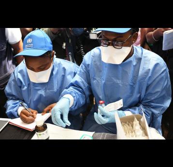 Health workers prepare the first shots of the Ebola vaccine in Mbandaka, DRC, during the 2018 outbreak. Credit: Gavi/2018/P Barollier.