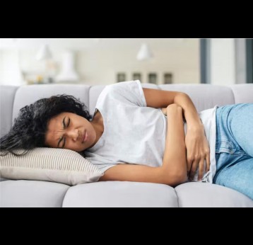 Woman with stomach pain. Credit: Vadym Pastukh/Shutterstock