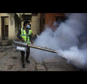 A man spraying anti-mosquito spray in Kathmandu. Credit: @sulav_photo