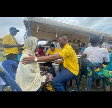 Dr Shodipo Gbolahan attending to an elderly woman from Snake Island during a free medical outreach session. Credit: Royal Ibeh