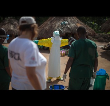 Health workers don full personal protective equipment in Guinea during the 2014-16 West Africa Ebola outbreak. Credit: Sean Hawkey