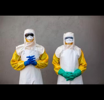 Staff from South Sudan’s Health Ministry pose with protective suits during a drill for Ebola preparedness. Credit: PATRICK MEINHARDT/AFP via Getty Images